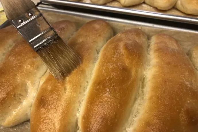 Brush a little garlic butter on the breadsticks while they’re hot